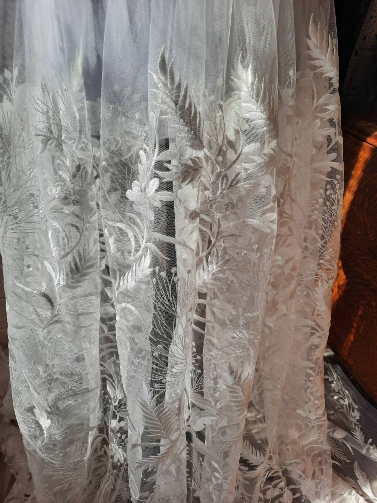 Floral bridal overskirt in off-white. Embroidered tulle with trailing flowers and leaves. Winter Woodland over skirt.