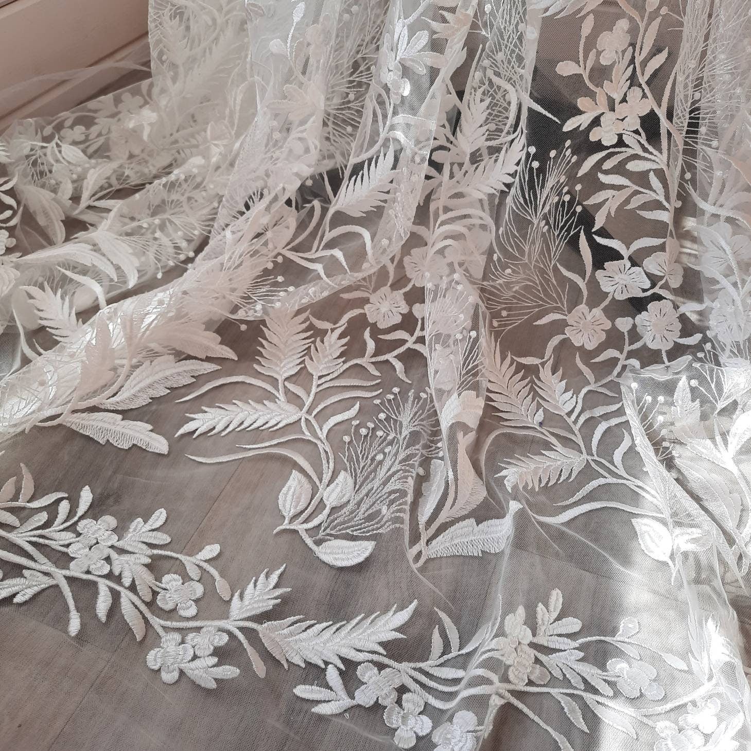 Floral bridal overskirt in off-white. Embroidered tulle with trailing flowers and leaves. Winter Woodland over skirt.