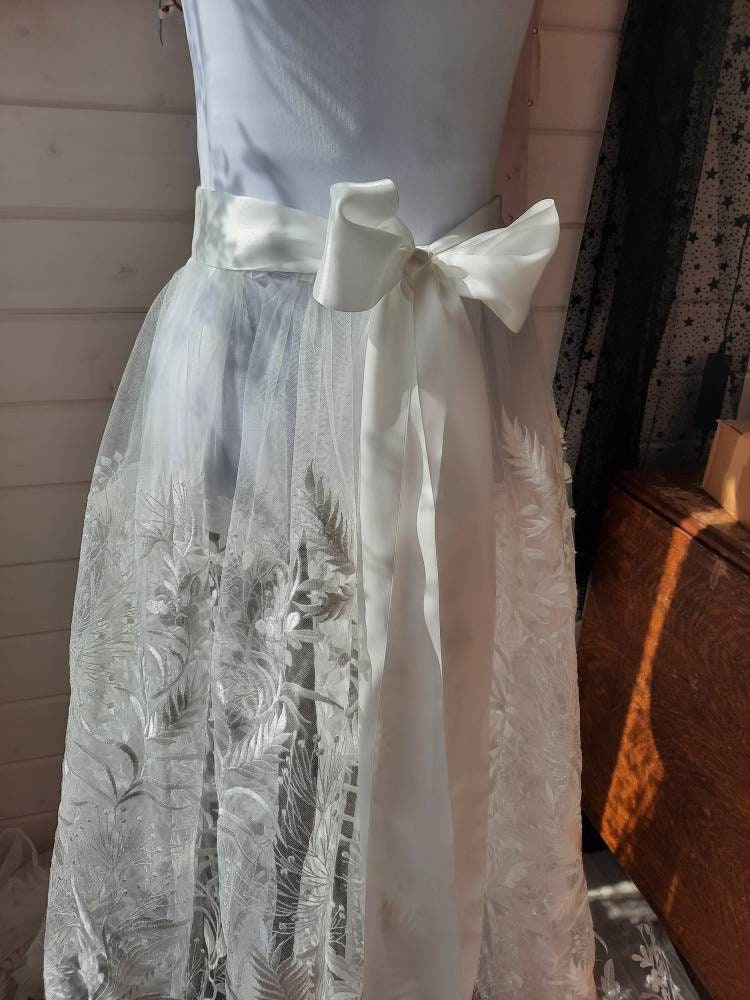 Floral bridal overskirt in off-white. Embroidered tulle with trailing flowers and leaves. Winter Woodland over skirt.